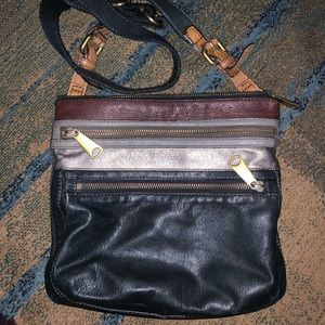 This is a gorgeous soft black and metallic leather Fossil crossbody.